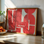 Modern interior design with a Valencia in Inseparable design, featuring the city's abbreviation in expressive typography over a detailed urban map designed in red and an off-white background, displayed on a living room wall