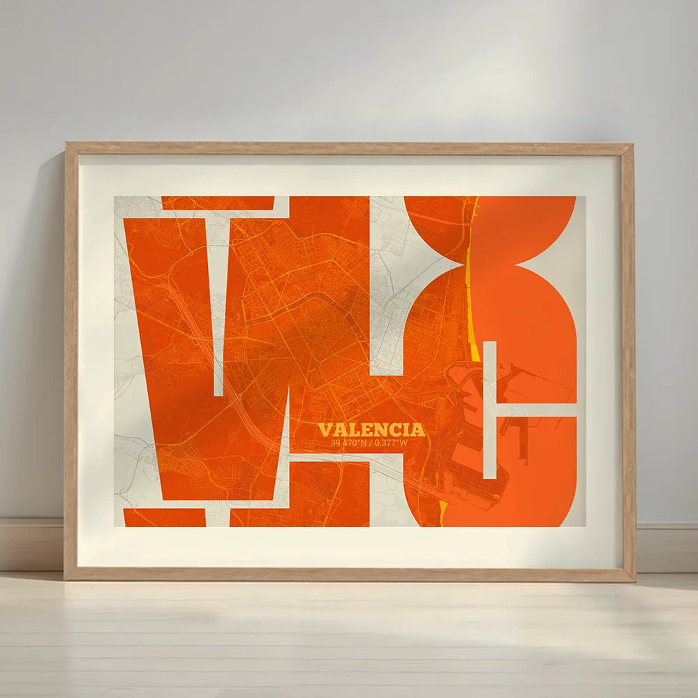 Framed Valencia in Inseparable design, featuring the city's abbreviation in expressive typography over a detailed urban map designed in orange and an off-white background with a white margin border in a warm lit minimalist setting