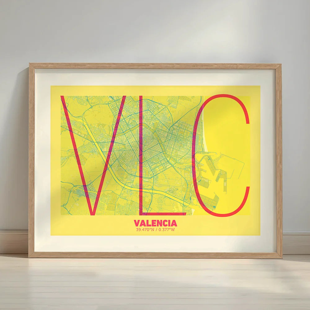 Framed Valencia in Ultralight design, a minimalist aesthetic combining urban cartography with modern, extra-thin elegant lettering designed in yellow and fuchsia with a white margin border in a warm lit minimalist setting
