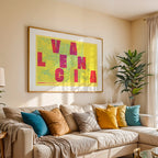 Modern interior design with a Valencia in Unruled design, where the city name letters appear randomly across different lines for a truly original urban layout designed in yellow and fuchsia, displayed on a living room wall