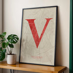 Modern interior design with a Valladolid in Classic design, inspired by chiseled typography with an elegant font that creates a beautiful visual contrast designed in red and an off-white background, displayed on a living room wall