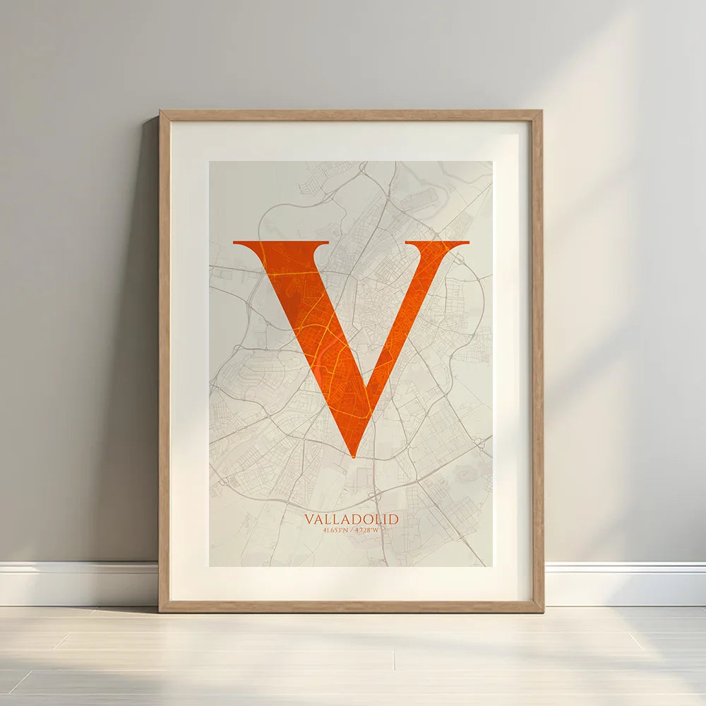 Framed Valladolid in Classic design, inspired by chiseled typography with an elegant font that creates a beautiful visual contrast designed in orange and an off-white background with a white margin border in a warm lit minimalist setting