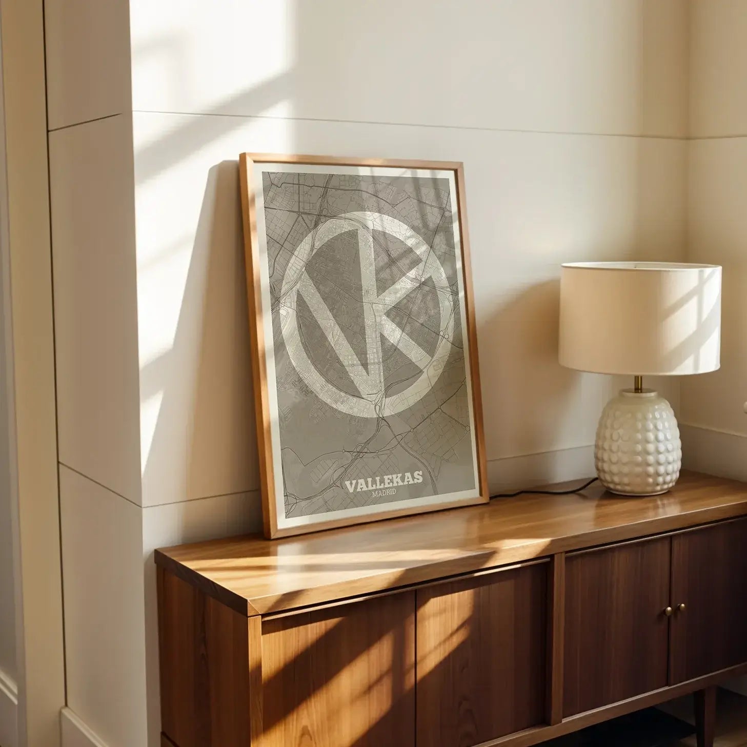 Modern interior design with a Vallecas in Super Bold design, a typographic poster where the city map is overlaid with extra-thick lettering for a modern, high-impact look designed in light brown and an off-white background, displayed on a living room wall
