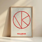 Framed Vallecas in Ultralight design, a minimalist aesthetic combining urban cartography with modern, extra-thin elegant lettering designed in red and an off-white background with no border edge-to-edge print leaning against a wall