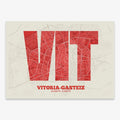Decorative print of Vitoria-Gasteiz composed with letters in a heavy geometric font printed on red and an off-white background