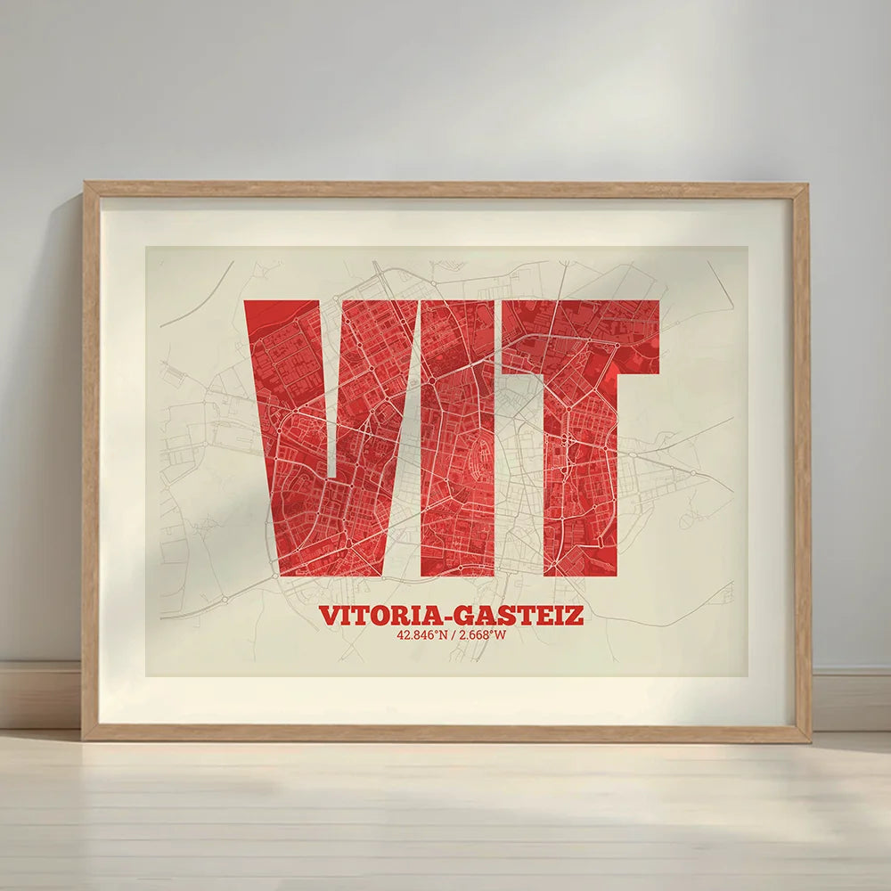 Framed Vitoria-Gasteiz in Super Bold design, a typographic poster where the city map is overlaid with extra-thick lettering for a modern, high-impact look designed in red and an off-white background with a white margin border in a warm lit minimalist setting
