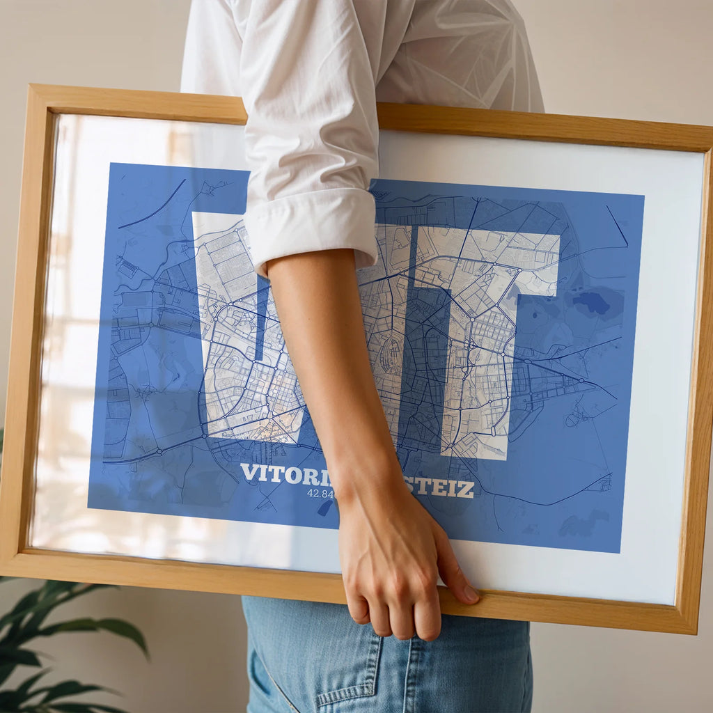 Modern interior design with a Vitoria-Gasteiz in Super Bold design, a typographic poster where the city map is overlaid with extra-thick lettering for a modern, high-impact look designed in navy blue and white, displayed on a living room wall