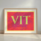 Framed Vitoria-Gasteiz in Classic design, inspired by chiseled typography with an elegant font that creates a beautiful visual contrast designed in yellow and fuchsia with a white margin border in a warm lit minimalist setting