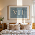 Modern interior design with a Vitoria-Gasteiz in Classic design, inspired by chiseled typography with an elegant font that creates a beautiful visual contrast designed in bluish gray and an off-white background, displayed on a living room wall