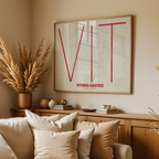 Modern interior design with a Vitoria-Gasteiz in Ultralight design, a minimalist aesthetic combining urban cartography with modern, extra-thin elegant lettering designed in red and an off-white background, displayed on a living room wall