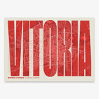 Decorative map of Vitoria-Gasteiz and letters of its name in a giclée print designed in red and an off-white background