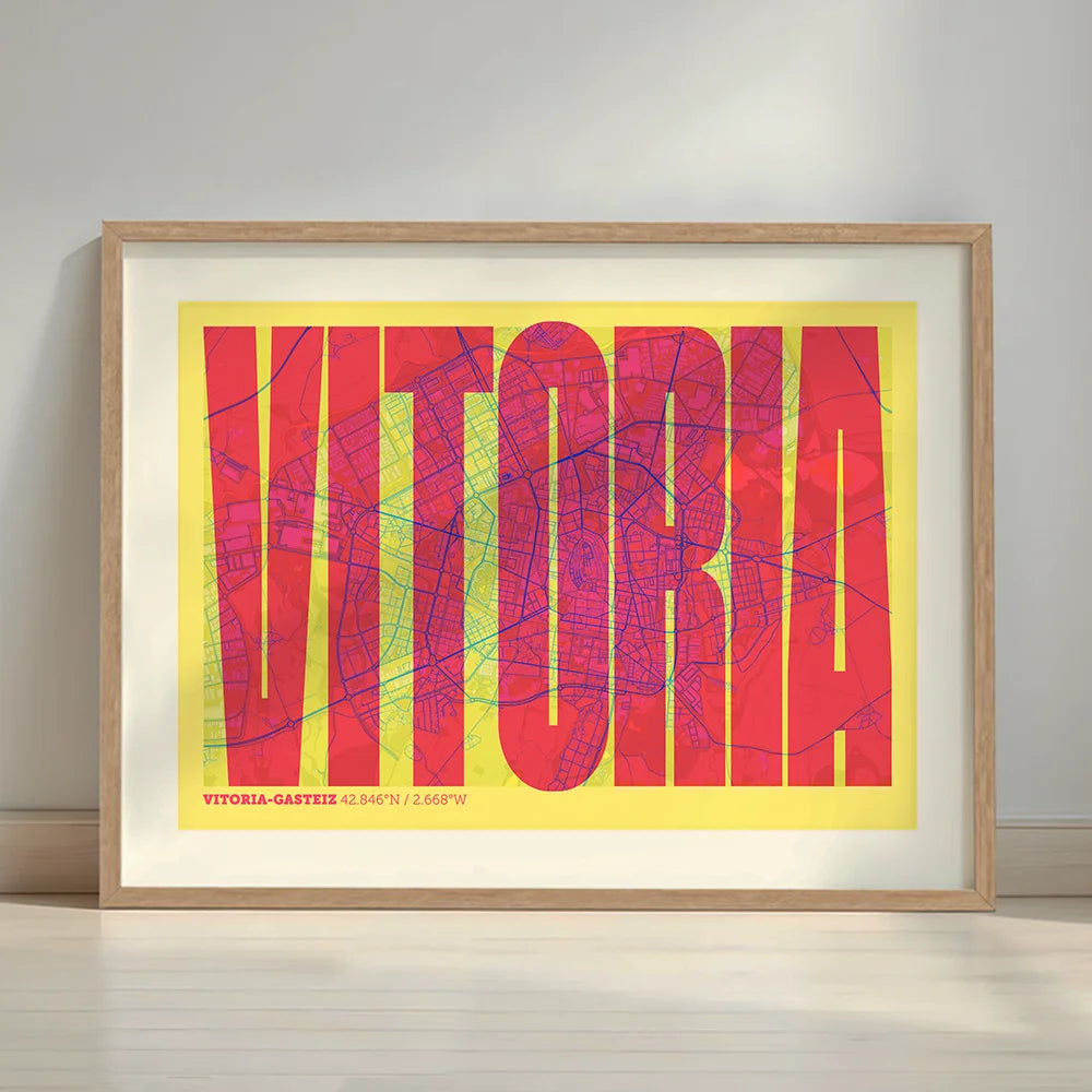 Framed Vitoria-Gasteiz in Extra Compressed design, where the letters are tightly squeezed to fit the city's map shape designed in yellow and fuchsia with a white margin border in a warm lit minimalist setting
