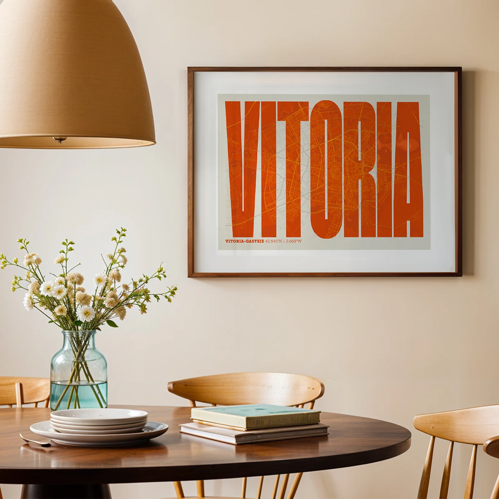 Modern interior design with a Vitoria-Gasteiz in Extra Compressed design, where the letters are tightly squeezed to fit the city's map shape designed in orange and an off-white background, displayed on a living room wall