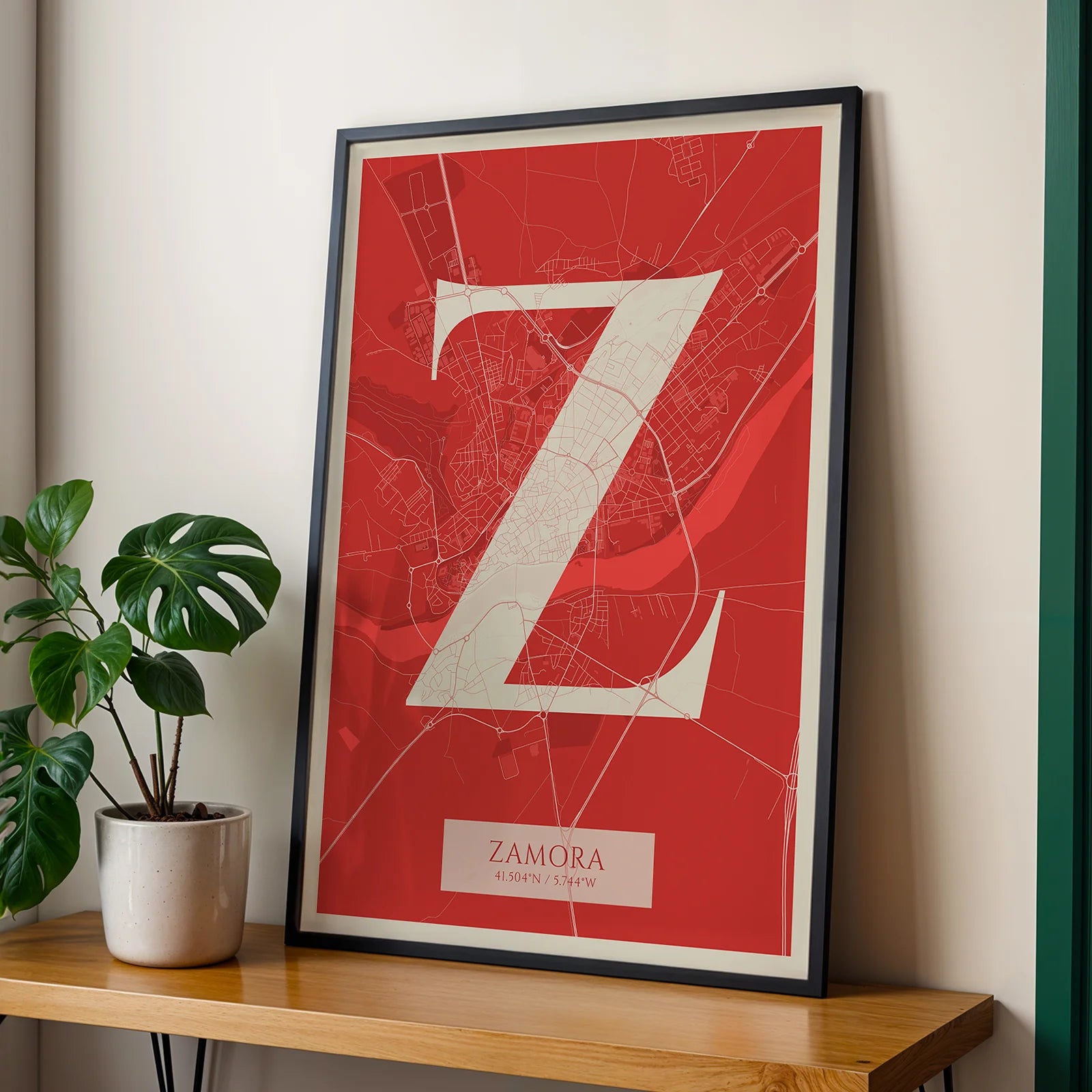 Modern interior design with a Zamora in Classic design, inspired by chiseled typography with an elegant font that creates a beautiful visual contrast designed in red and an off-white background, displayed on a living room wall