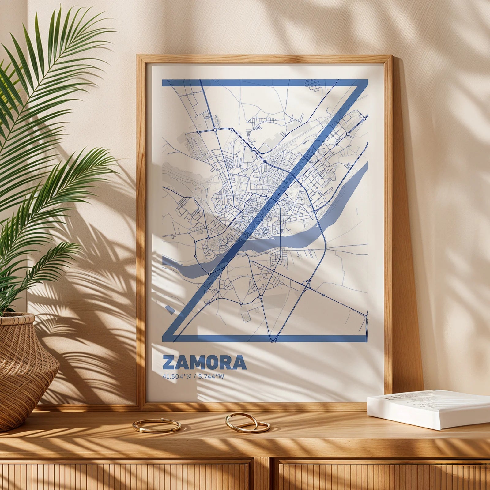 Modern interior design with a Zamora in Ultralight design, a minimalist aesthetic combining urban cartography with modern, extra-thin elegant lettering designed in navy blue and white, displayed on a living room wall