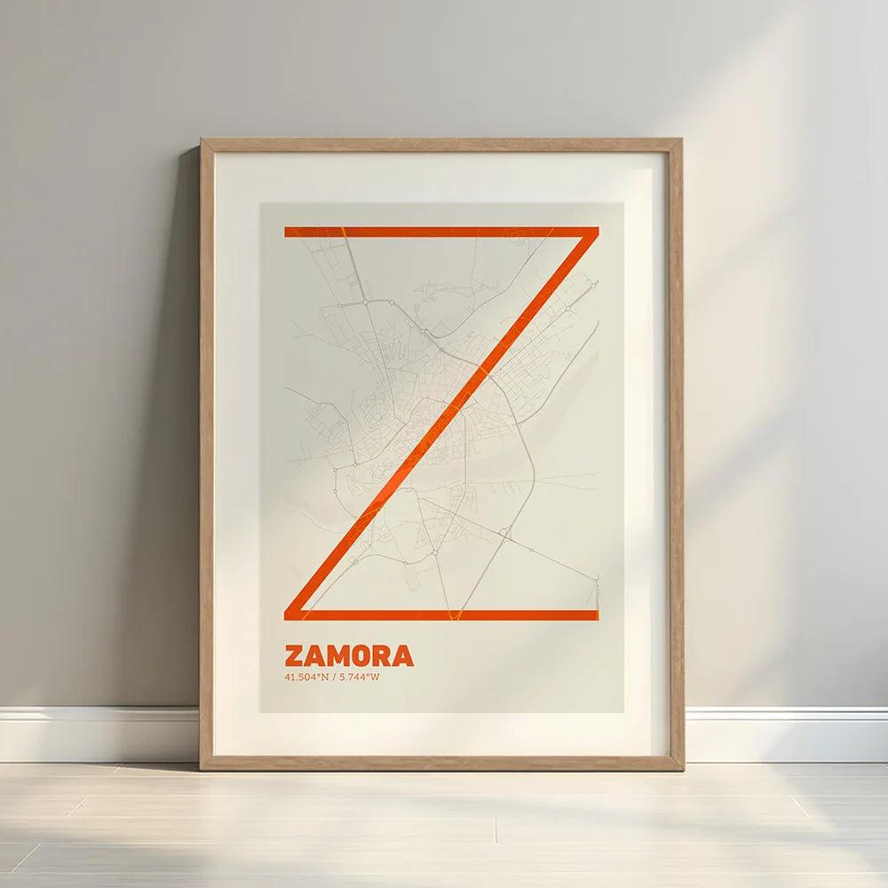 Framed Zamora in Ultralight design, a minimalist aesthetic combining urban cartography with modern, extra-thin elegant lettering designed in orange and an off-white background with a white margin border in a warm lit minimalist setting