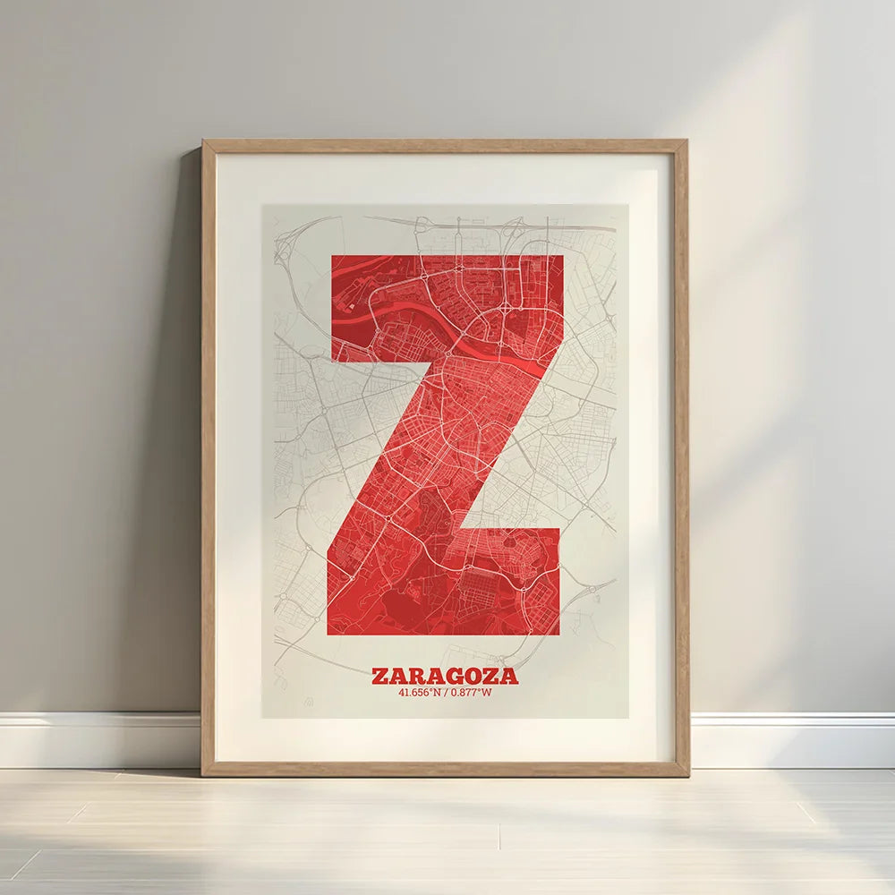 Framed Zaragoza in Super Bold design, a typographic poster where the city map is overlaid with extra-thick lettering for a modern, high-impact look designed in red and an off-white background with a white margin border in a warm lit minimalist setting