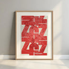 Framed Zaragoza in Inseparable design, featuring the city's abbreviation in expressive typography over a detailed urban map designed in red and an off-white background with a white margin border in a warm lit minimalist setting