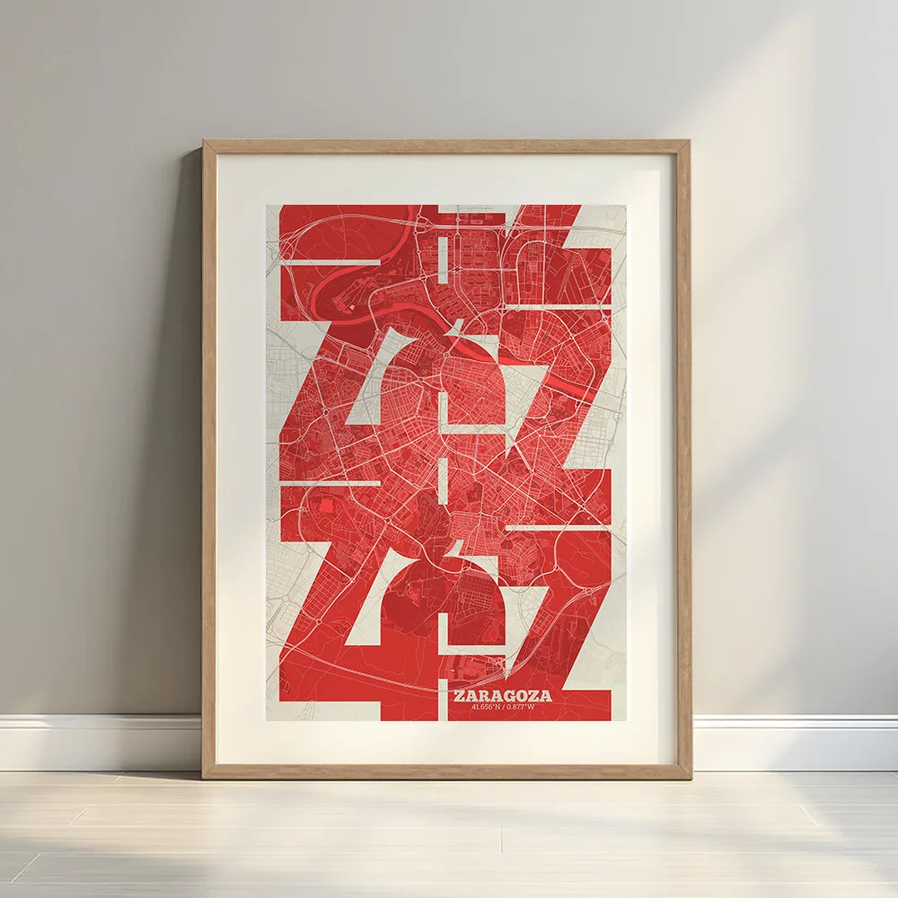 Framed Zaragoza in Inseparable design, featuring the city's abbreviation in expressive typography over a detailed urban map designed in red and an off-white background with a white margin border in a warm lit minimalist setting